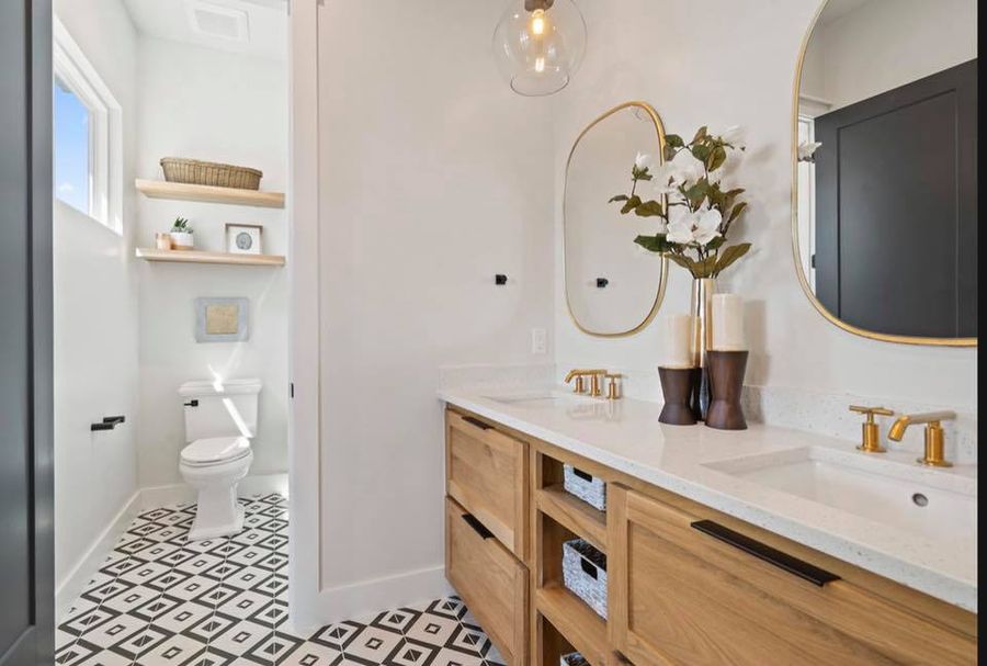 Master bathroom with brass fixtures and natural stone